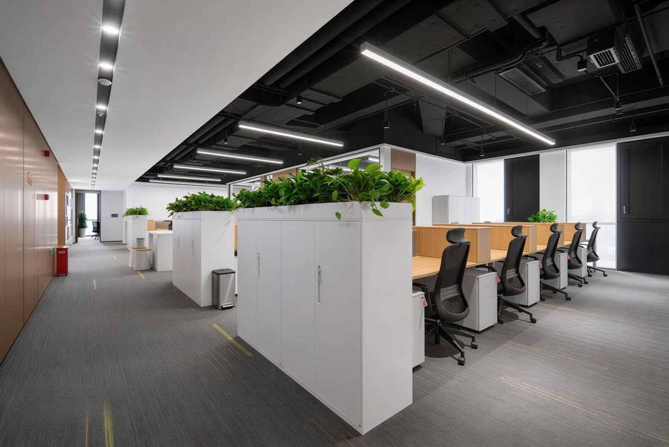Modern commercial office interior with workstations and meeting zones