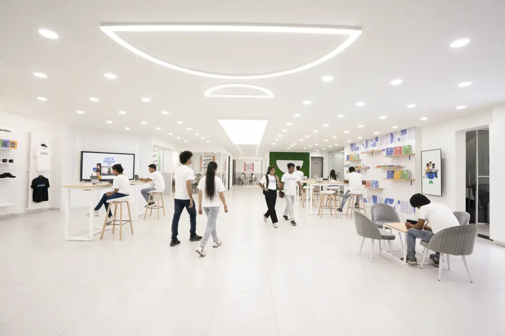 Corporate office with reception, meeting zones, and collaborative workspace